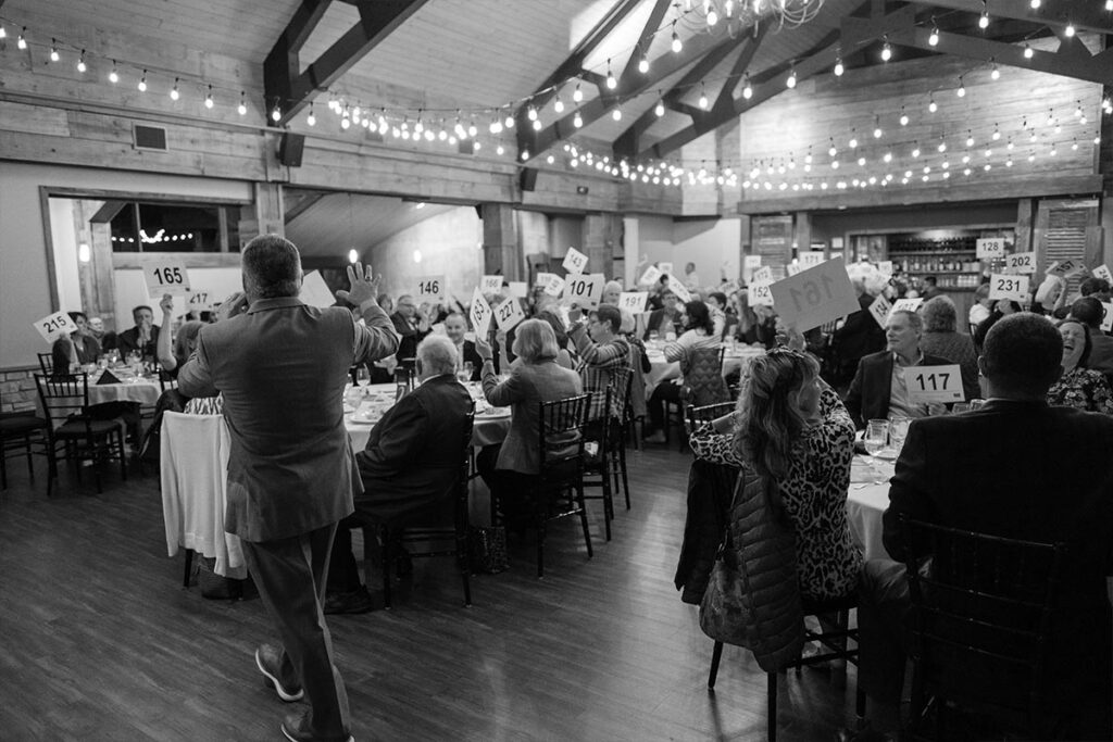 Auctioneer taking numbers at an auction