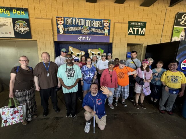 Individuals at a Kane County Cougars baseball game