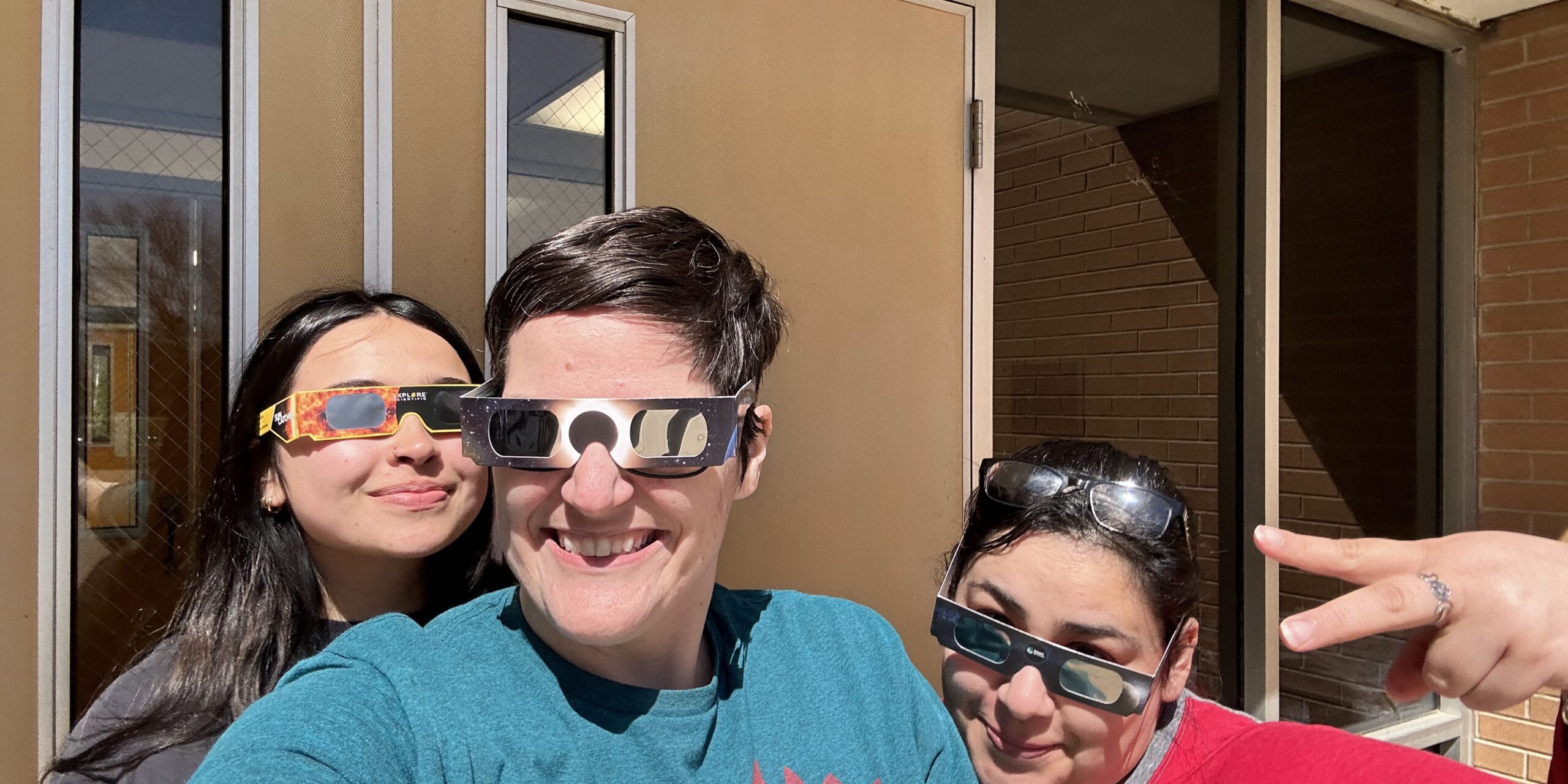 IMG_4781 Individuals posing with eclipse glasses