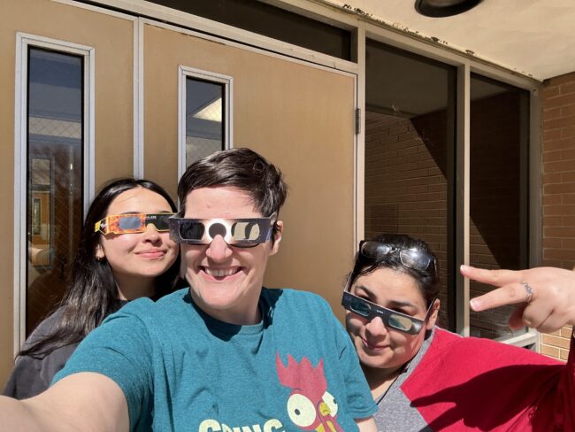 IMG_4781 Individuals posing with eclipse glasses