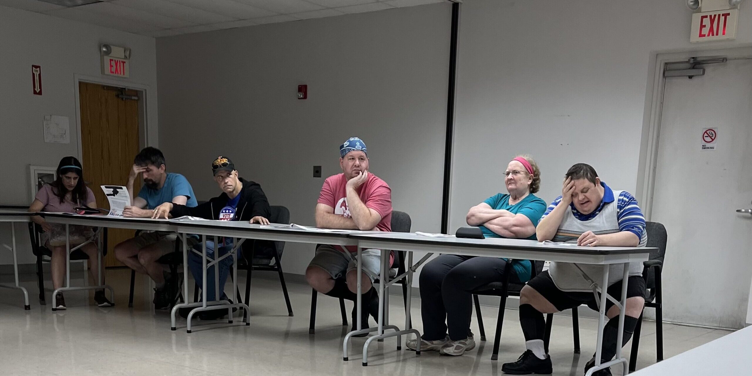 Individuals participating in a voter's education event