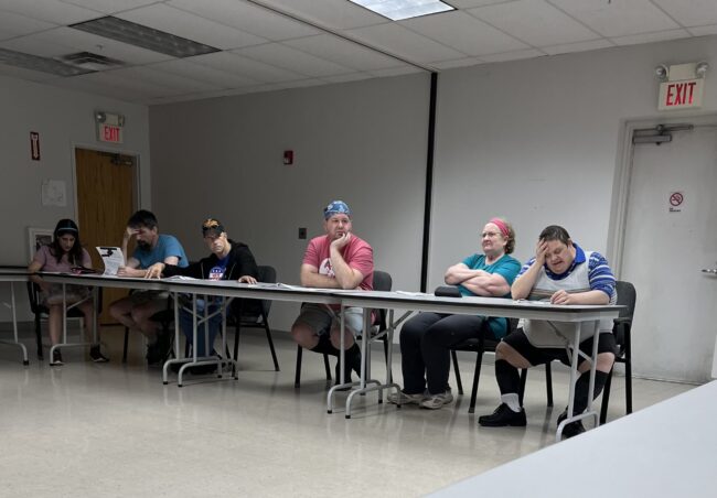 Individuals participating in a voter's education event