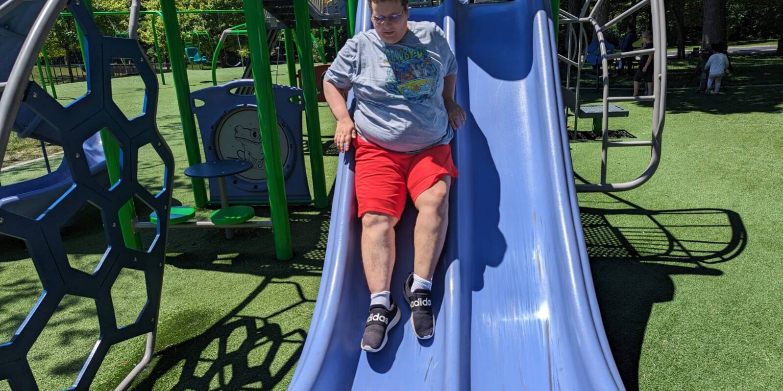 Individual sliding down a slide