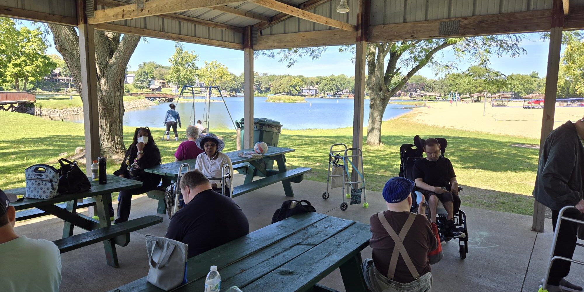 Individuals having lunch in a pavillion