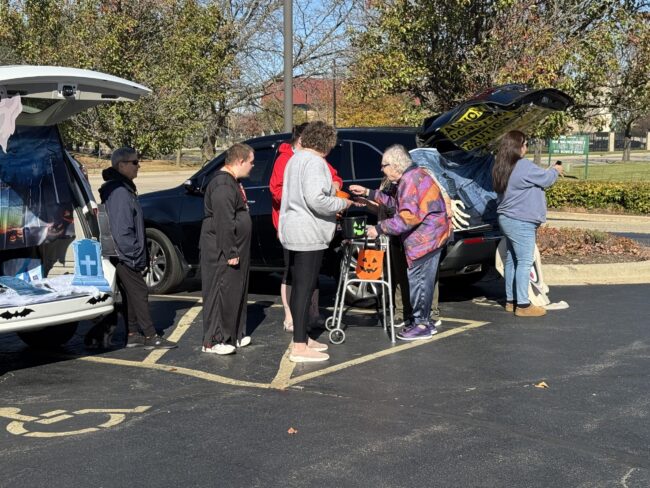 Individuals going Trunk-Or-Treating