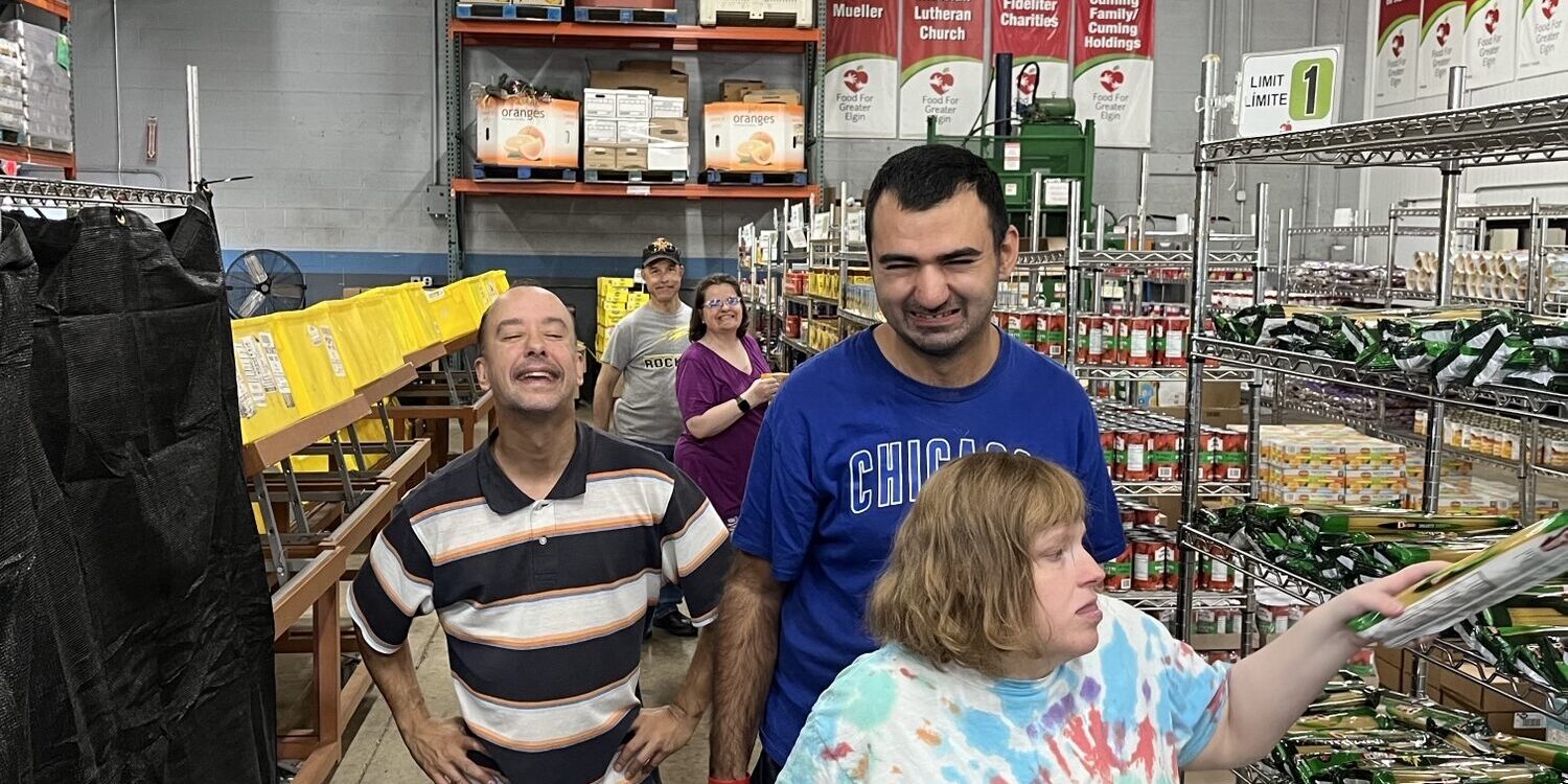 Individuals volunteering at a food bank