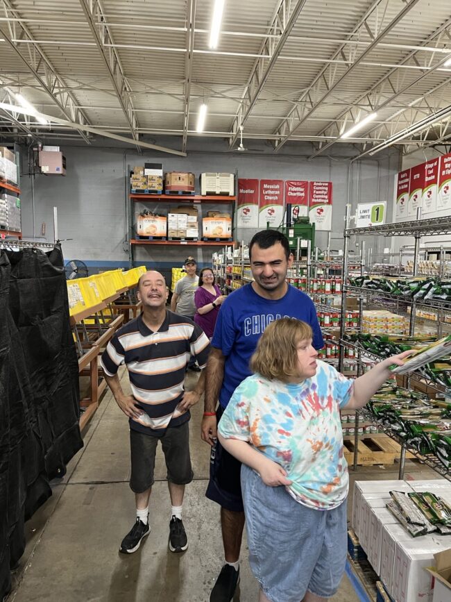 Individuals volunteering at a food bank