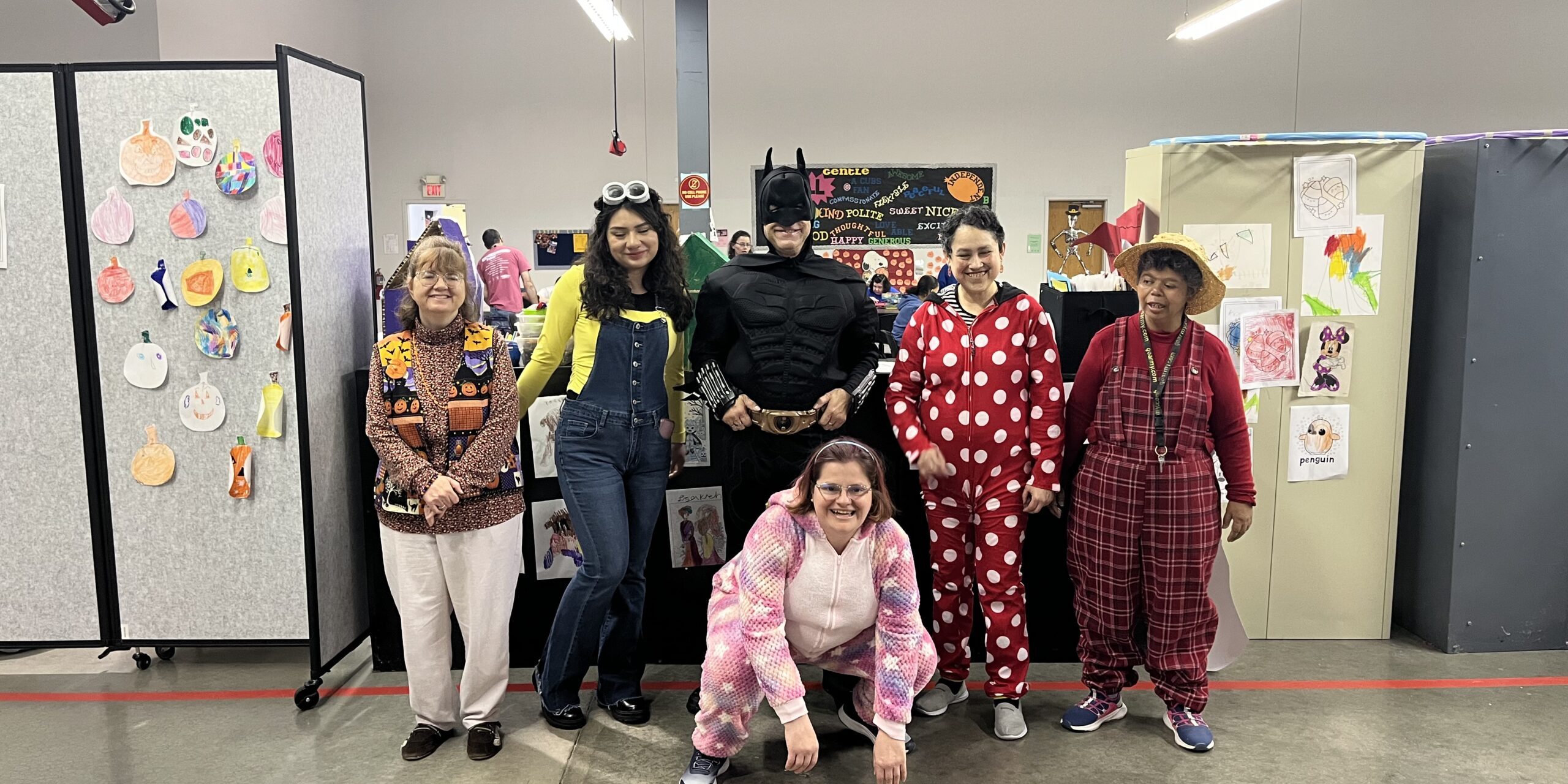 Individuals in Halloween Costumes posing for a picture