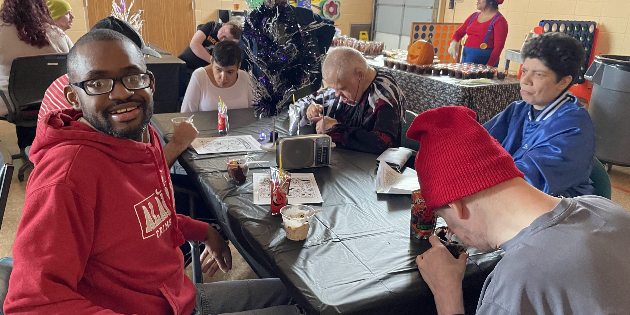 Individuals posing for a picture at a Halloween Party
